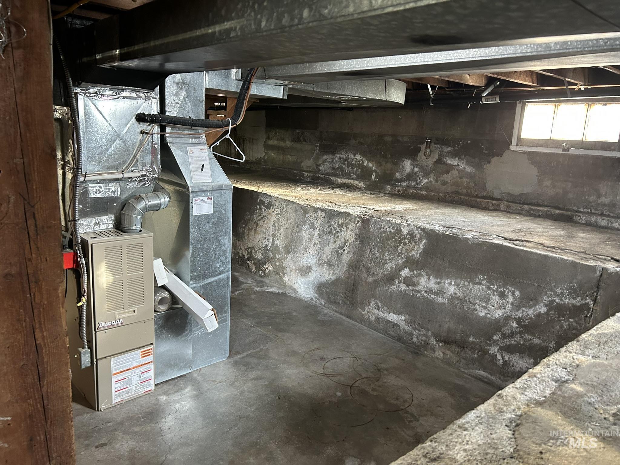 Below grade area with heating unit