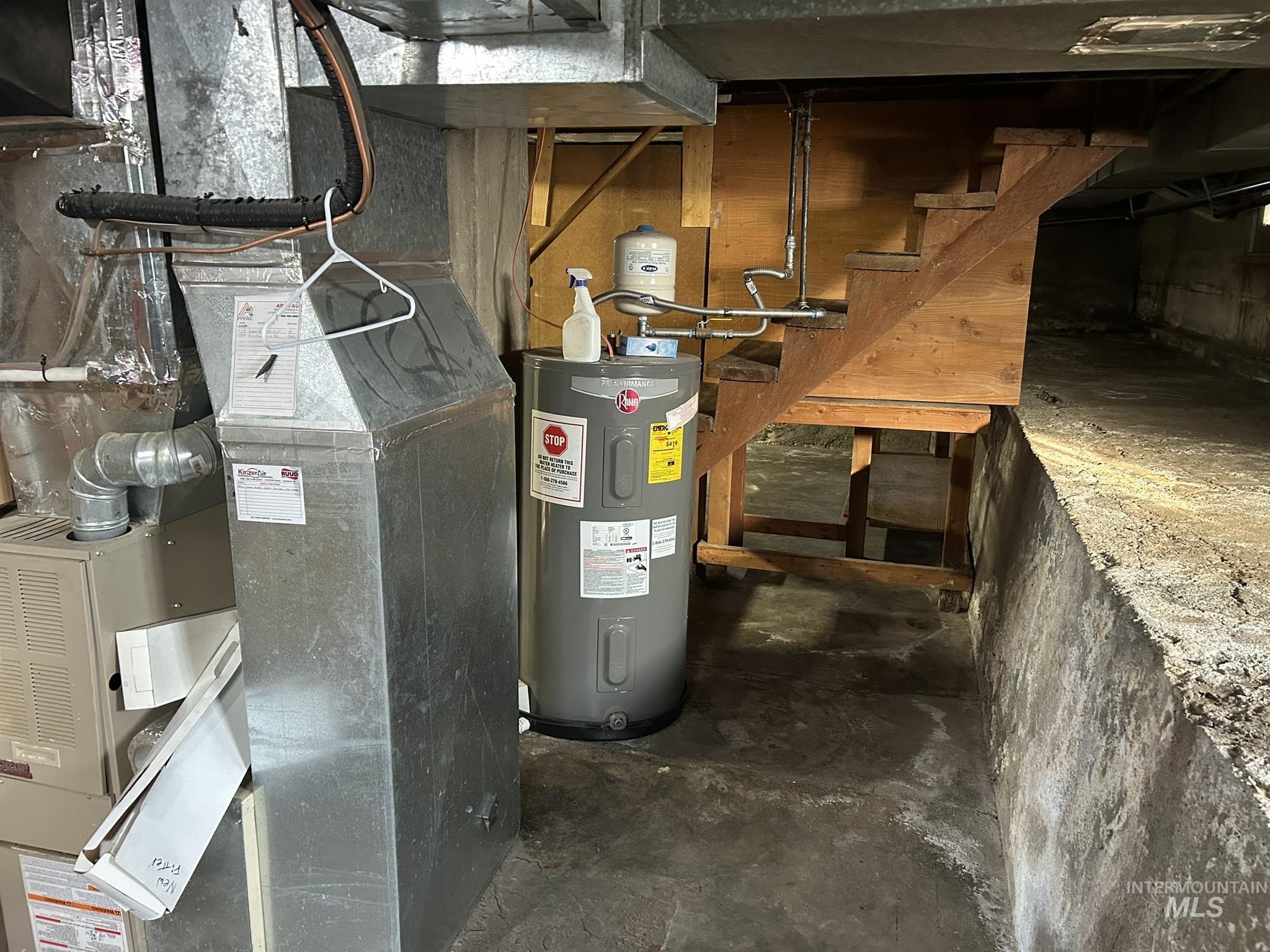 Utility room with heating unit and electric water heater