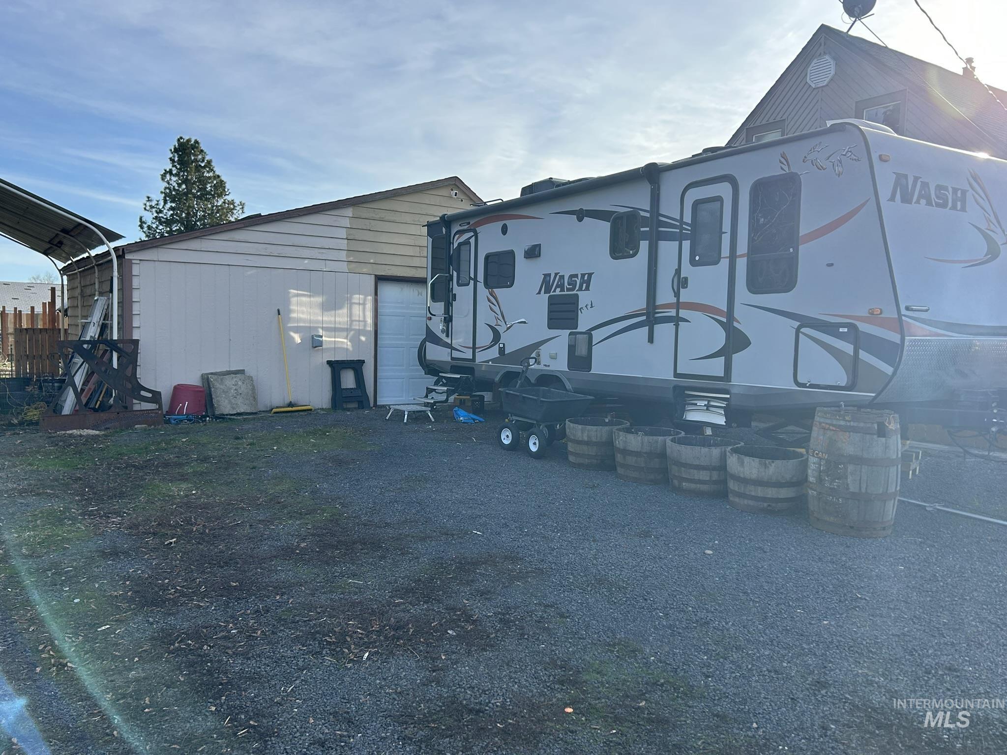 Rear view of property with a garage