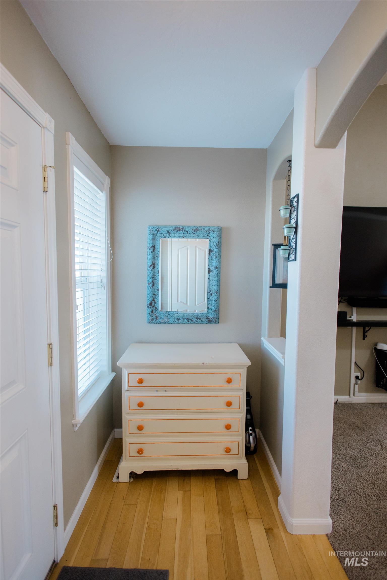 Bedroom featuring light wood-style floors and baseboards