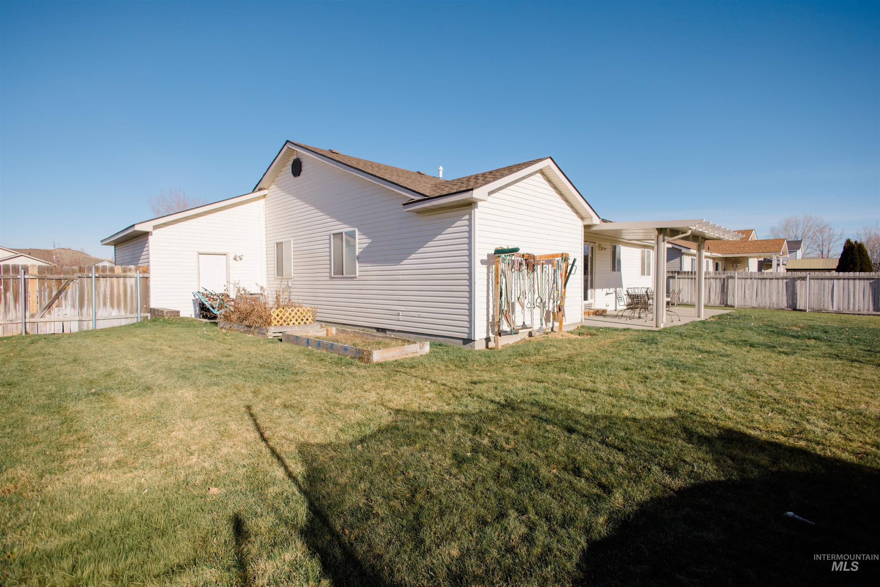 Back of property featuring a patio area and a fenced backyard