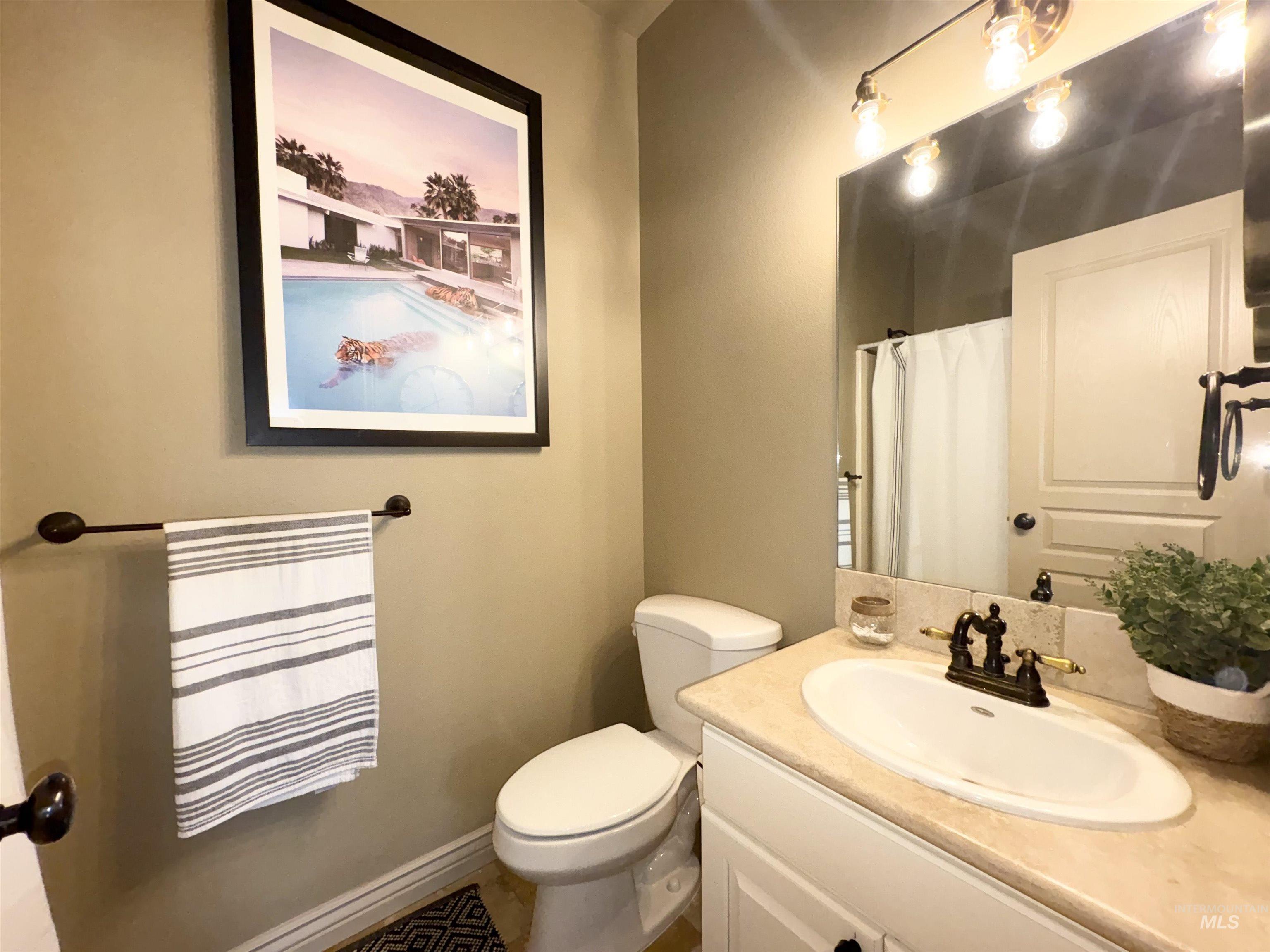 Bathroom featuring vanity and a shower with shower curtain