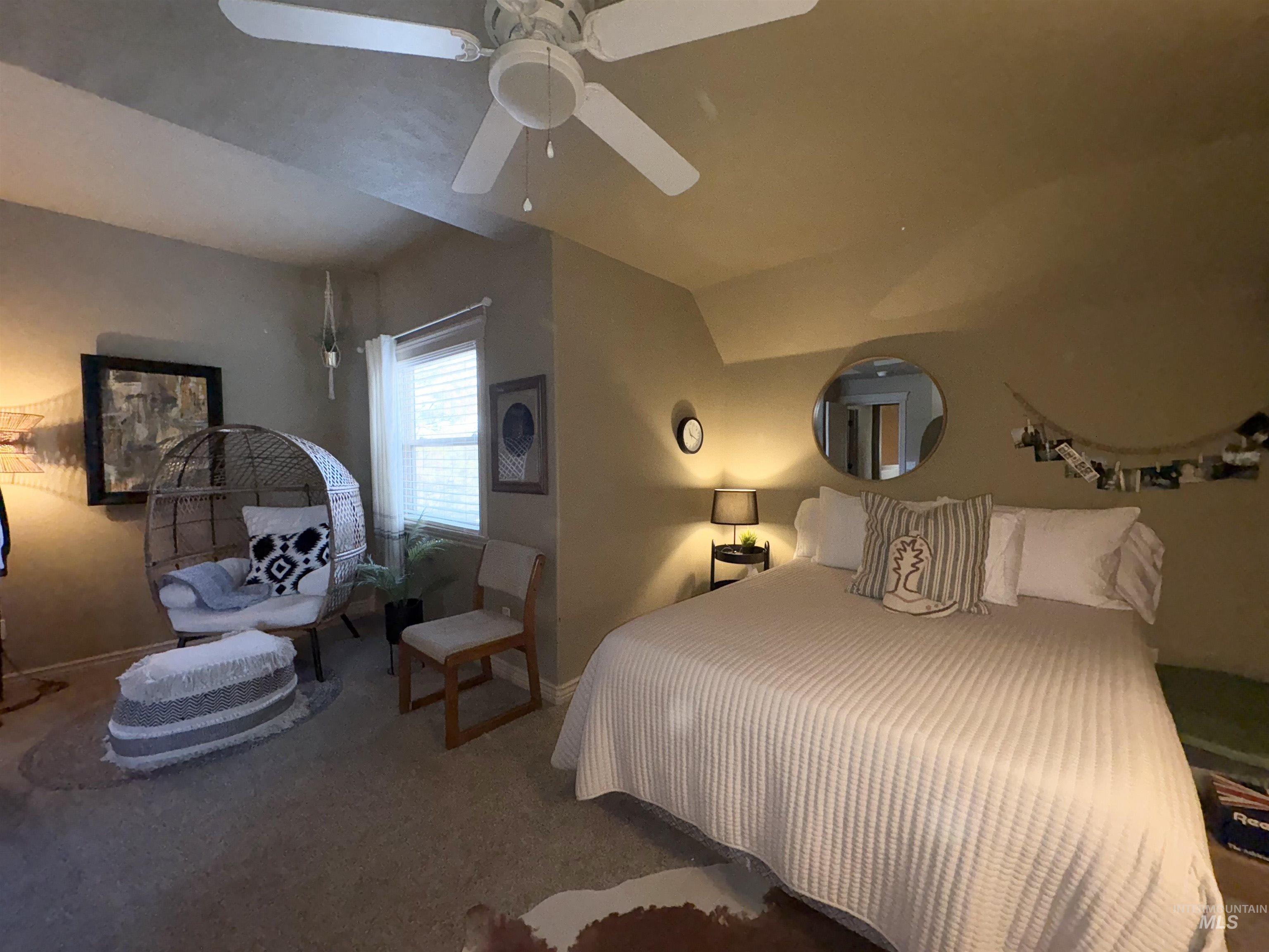 Bedroom with ceiling fan and carpet flooring