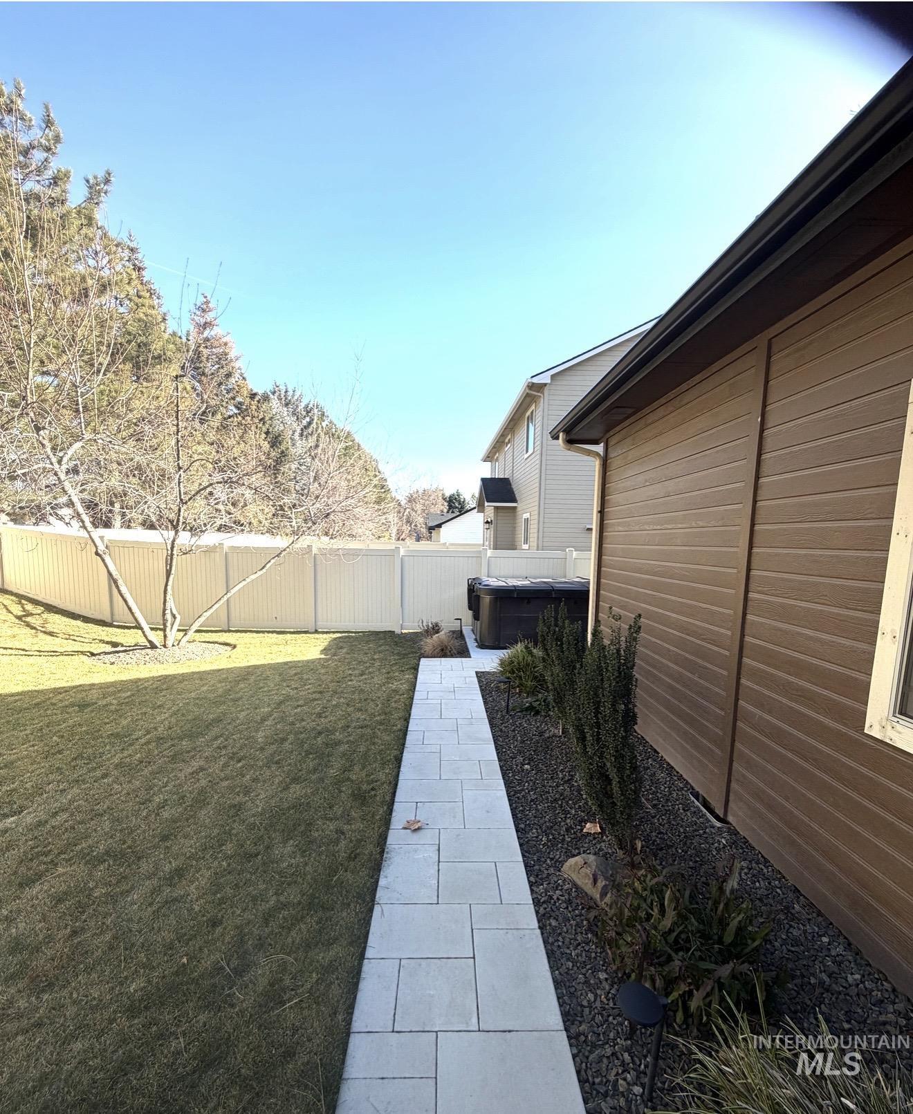 View of fenced backyard