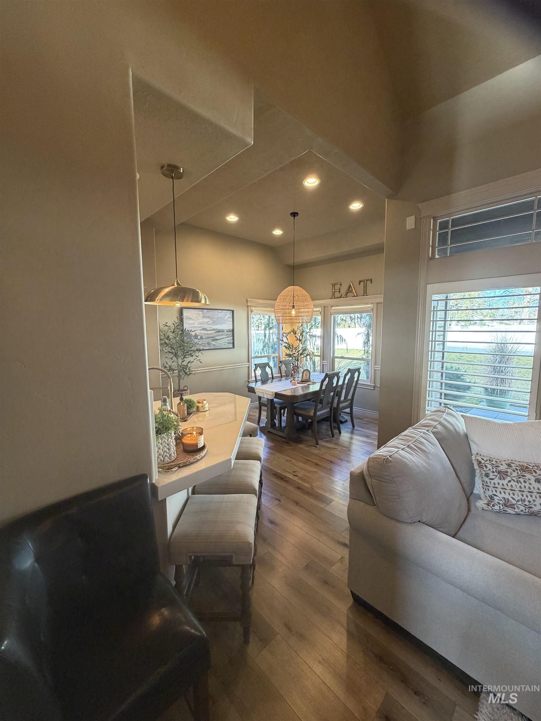 Living area featuring dark wood-style floors and recessed lighting