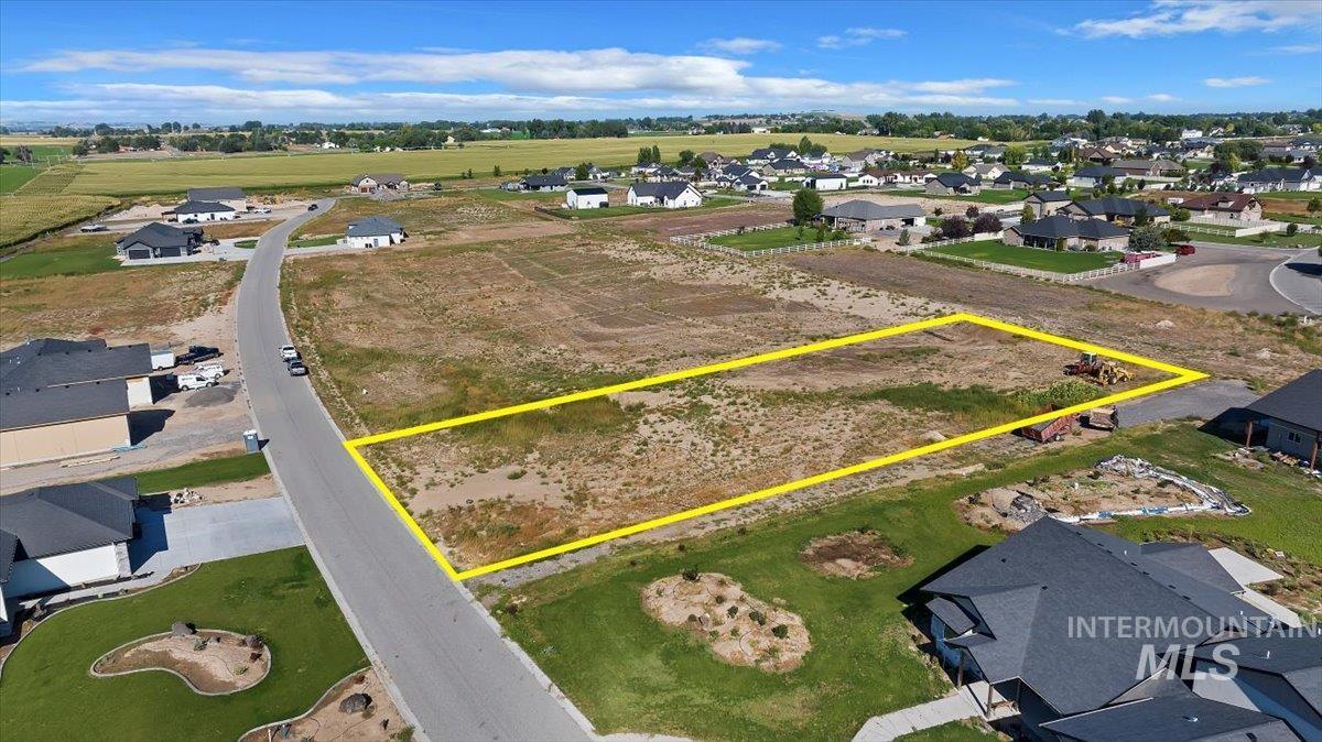 Aerial perspective of suburban area featuring property boundaries highlighted
