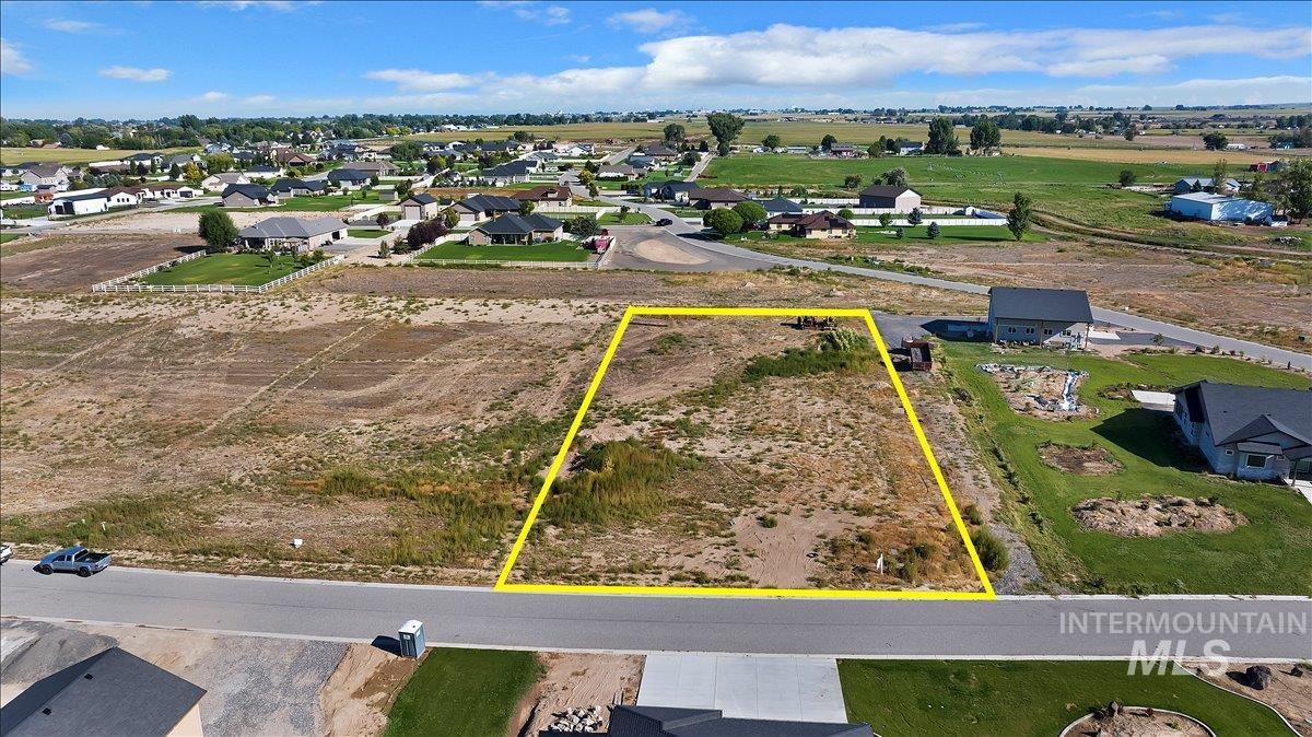 Aerial view of residential area with property boundaries highlighted
