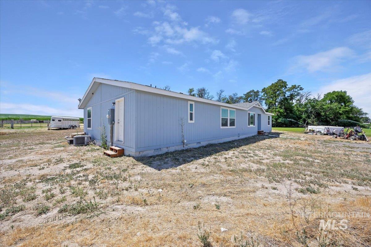 Back of property featuring crawl space