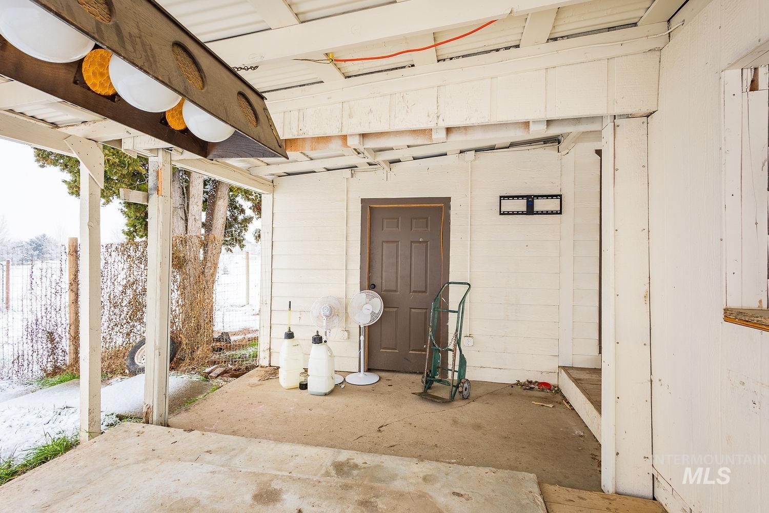 Below grade area featuring wood walls