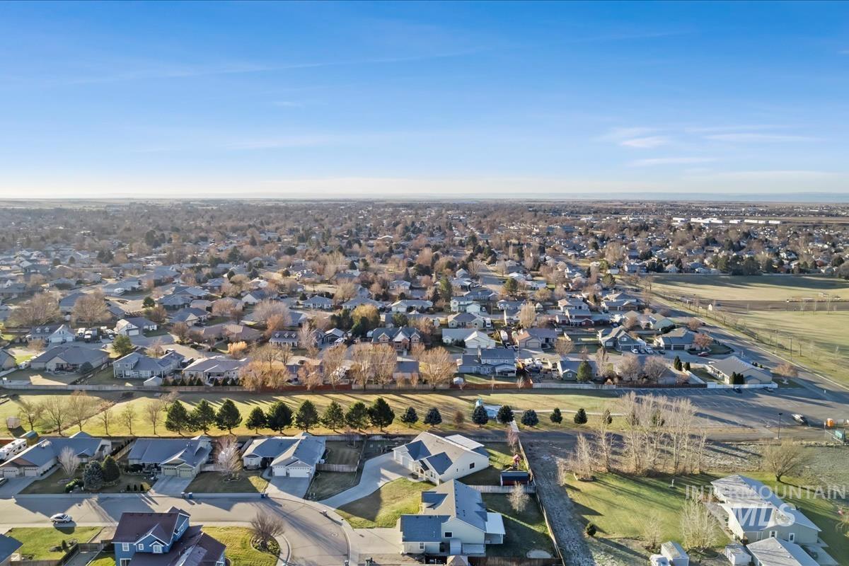 View of property location with nearby suburban area