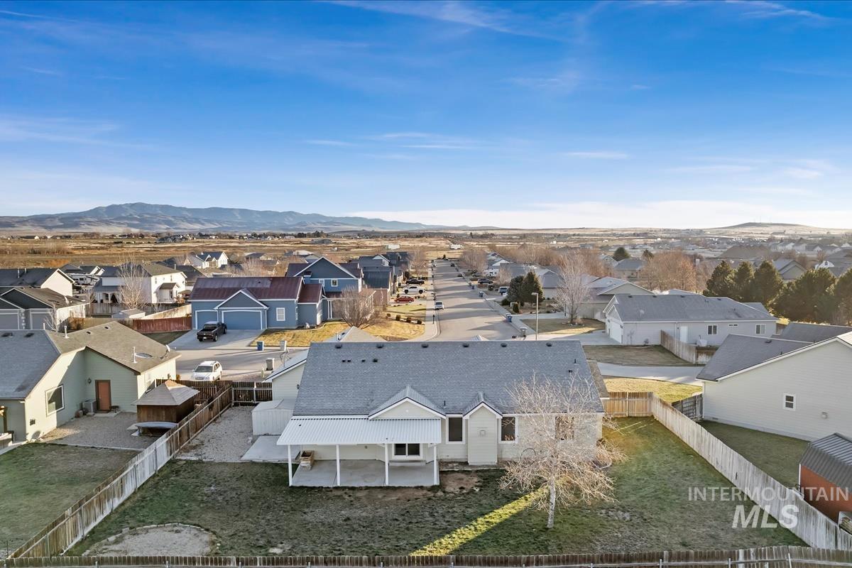 Aerial view of residential area with a mountainous background