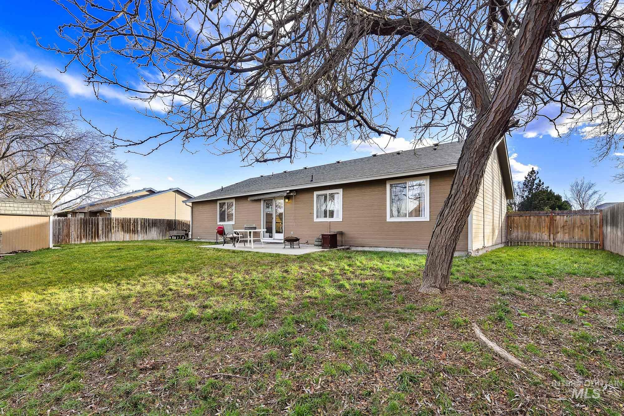 Back of house with a patio area and a fenced backyard