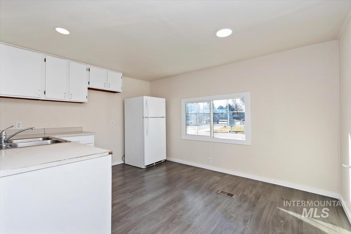 Washroom featuring dark wood finished floors and recessed lighting