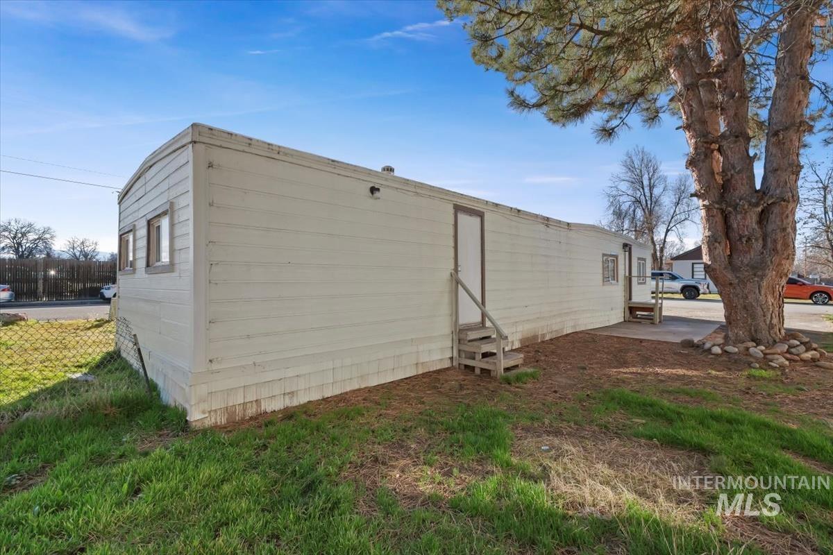 View of side of home featuring entry steps