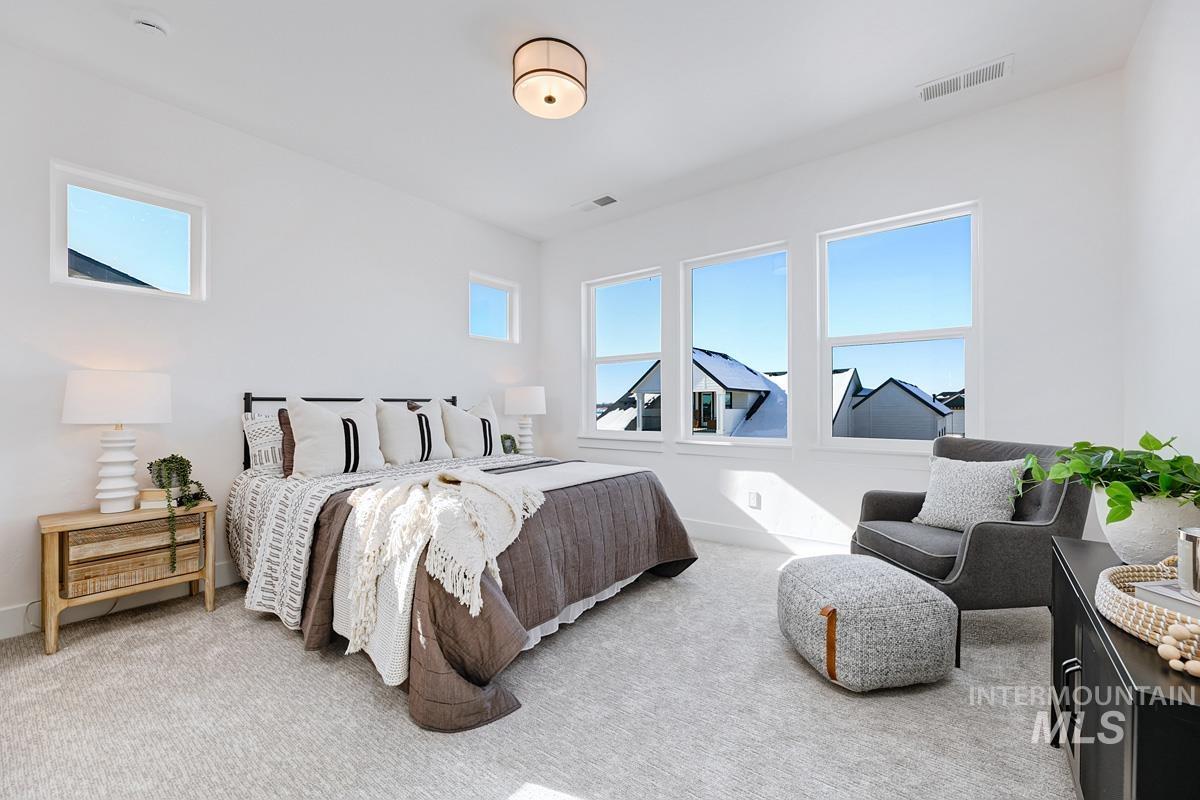 Carpeted bedroom with baseboards