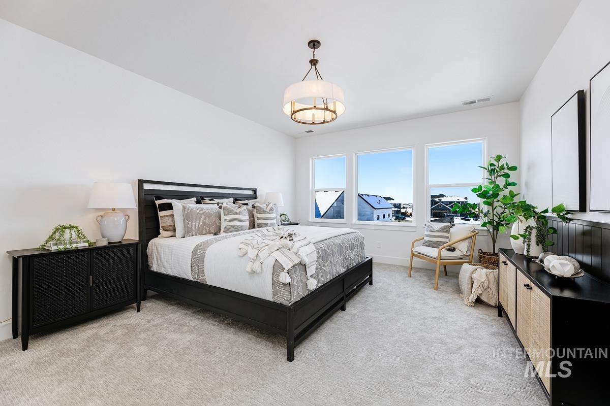 Bedroom with light carpet