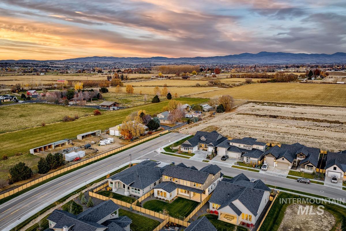 Aerial perspective of suburban area featuring a mountain backdrop
