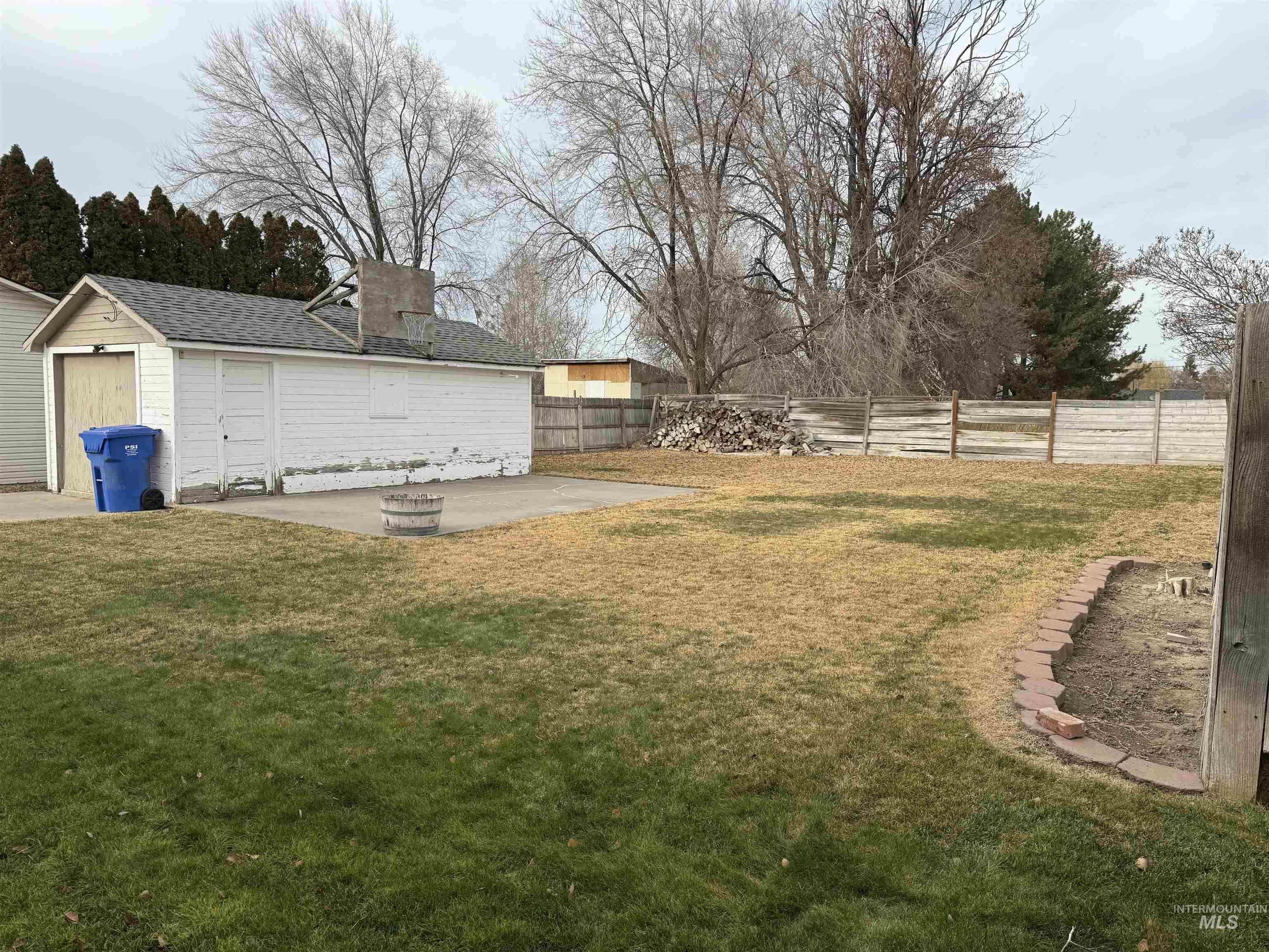 Fenced backyard featuring a patio
