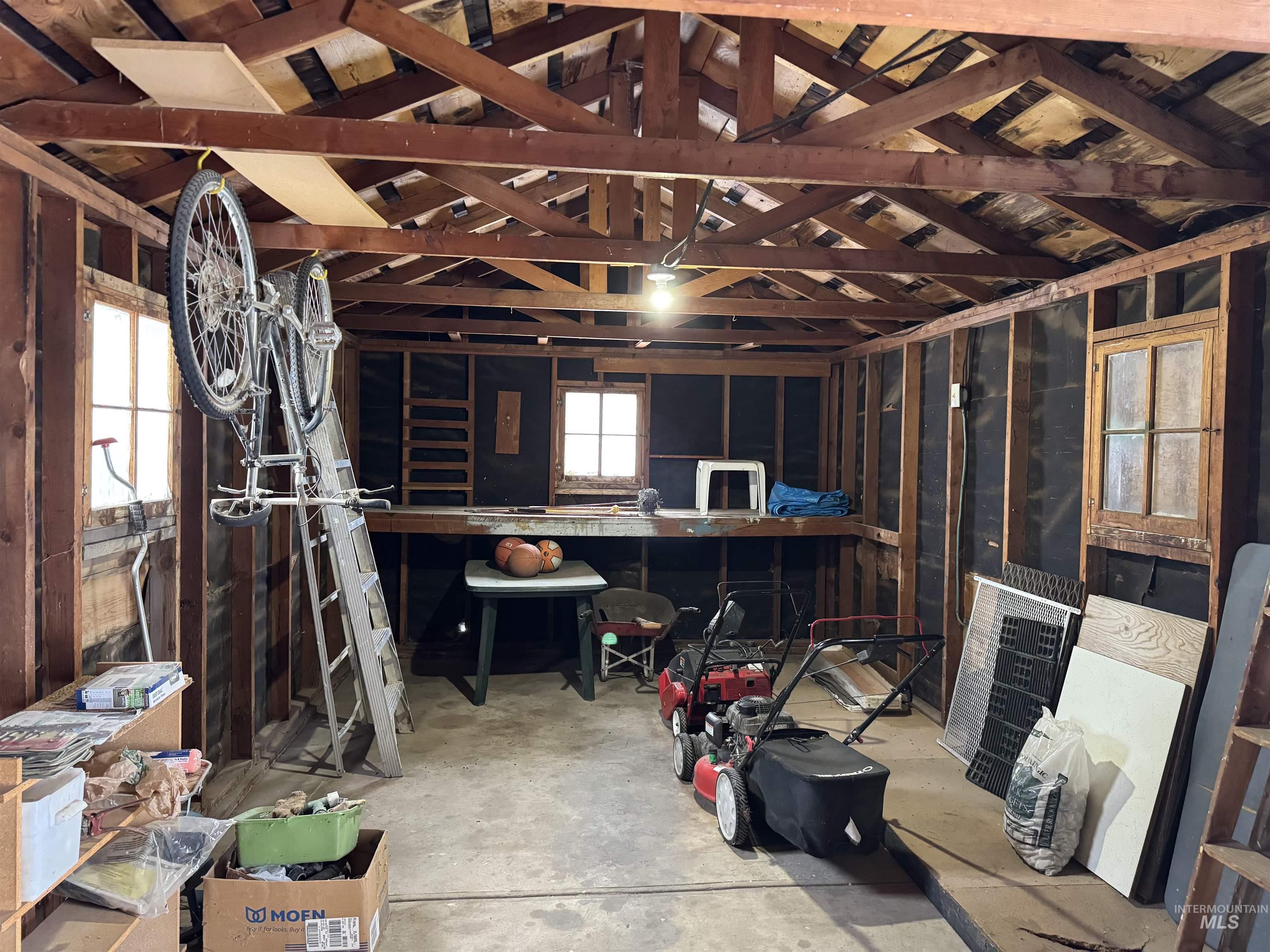 Misc room featuring unfinished concrete flooring and heating unit