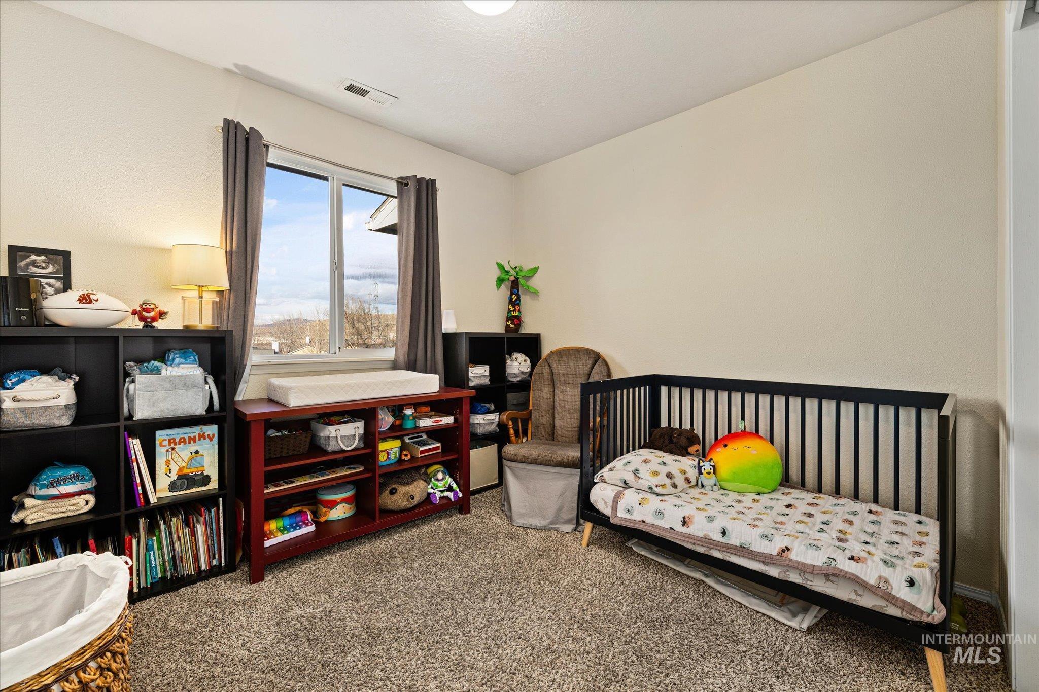 Bedroom featuring carpet