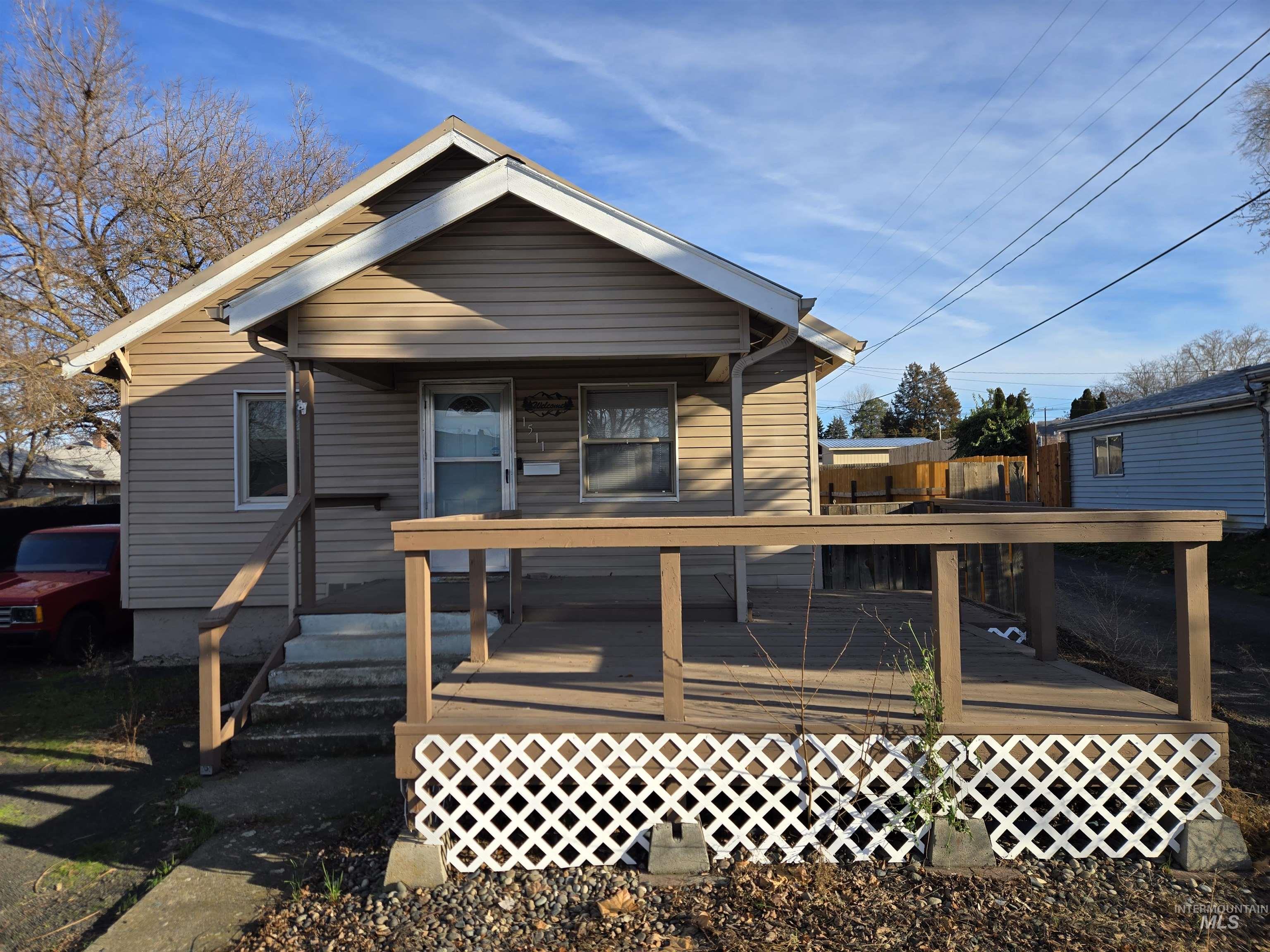 Rear view of house featuring a deck