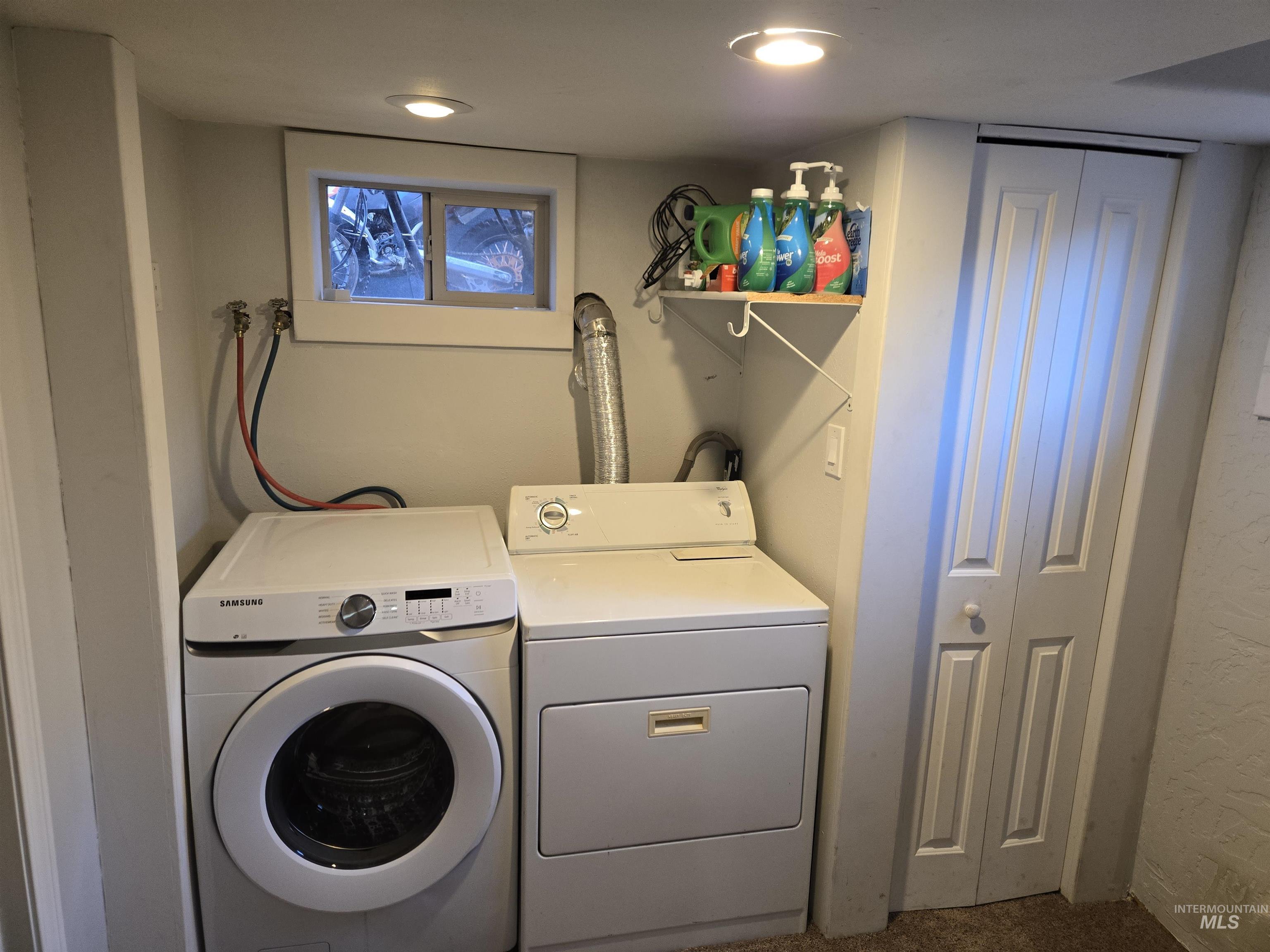 Washroom featuring washer and dryer