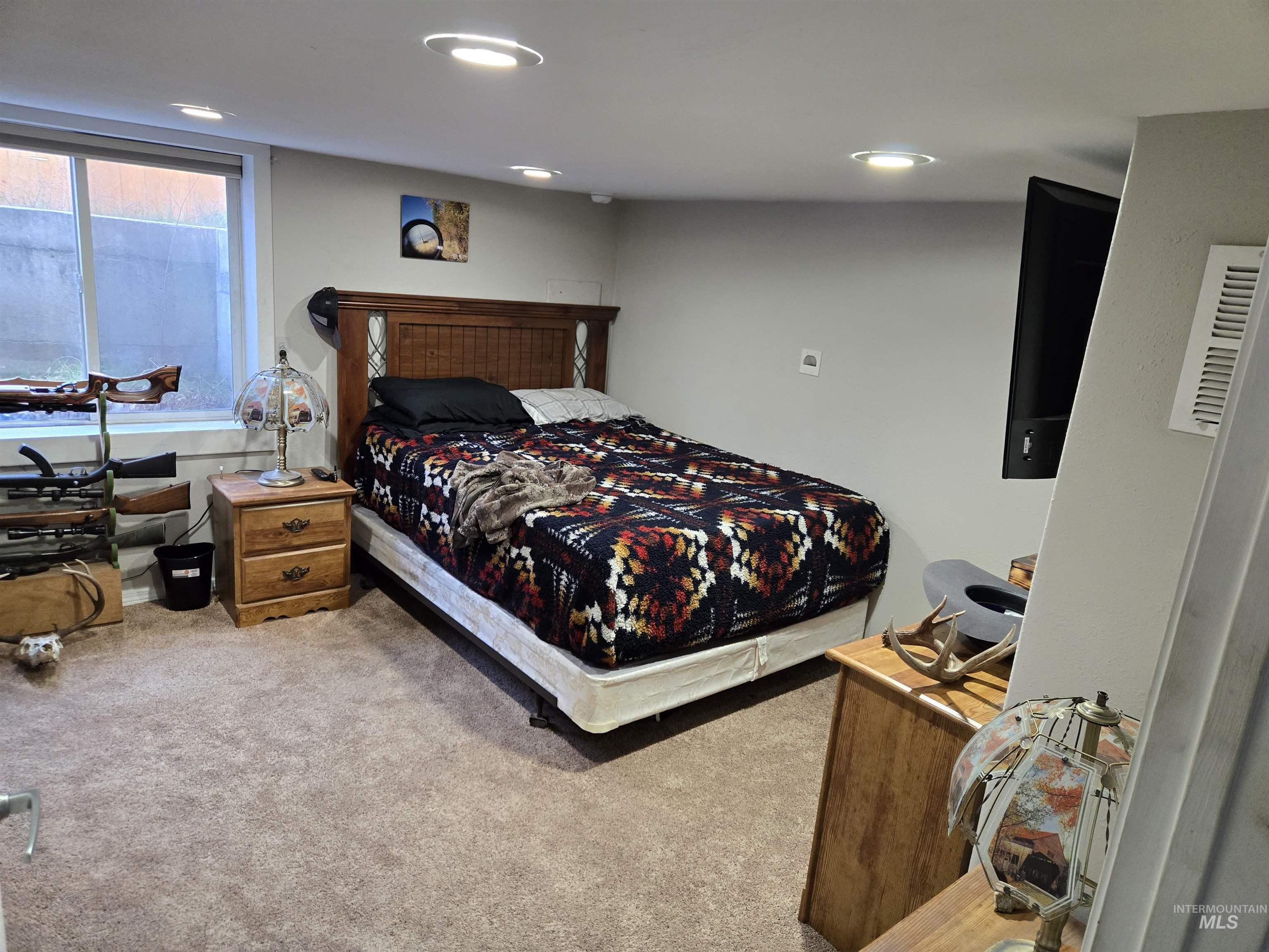Bedroom with carpet floors and recessed lighting