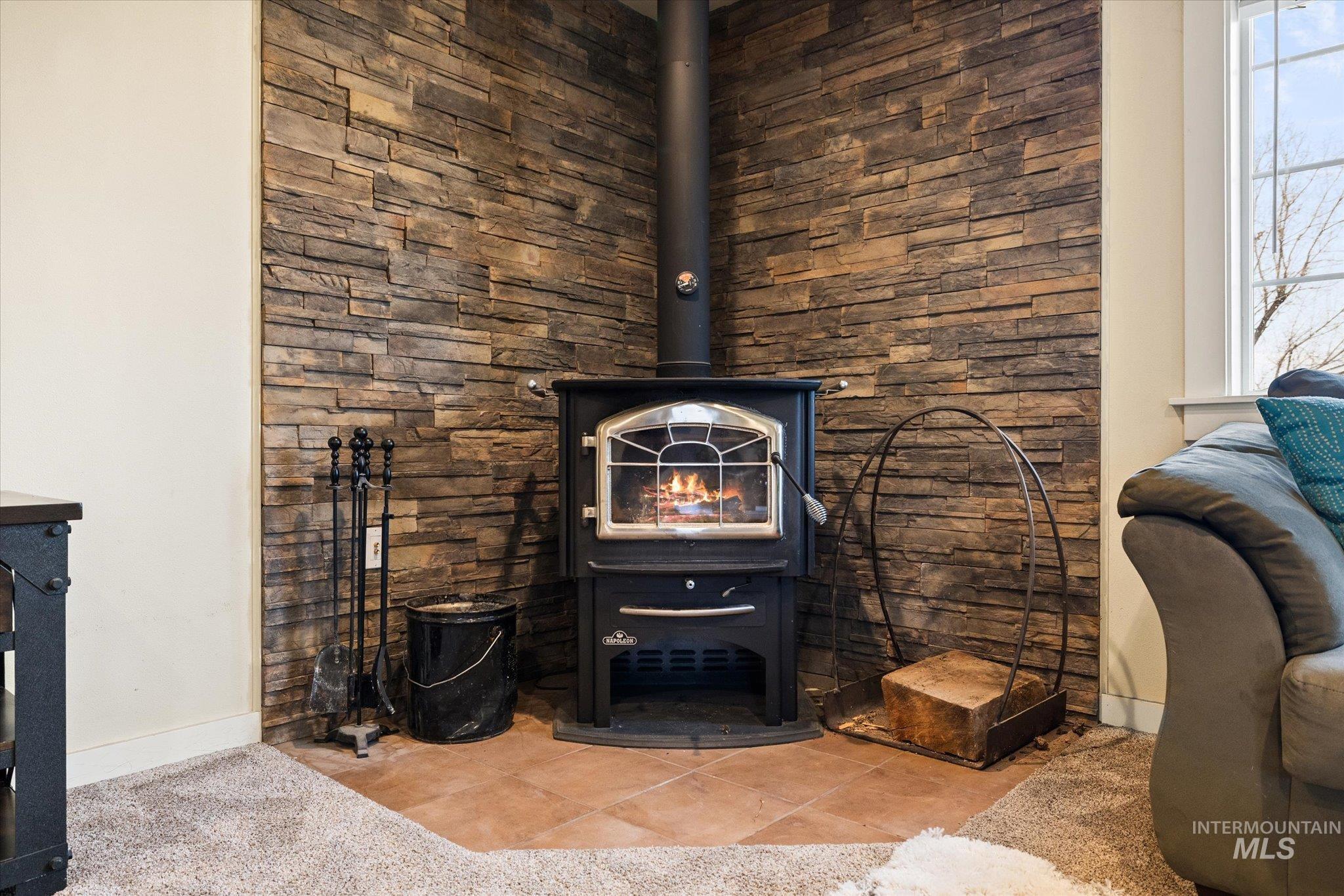 Detailed view of a wood stove and baseboards