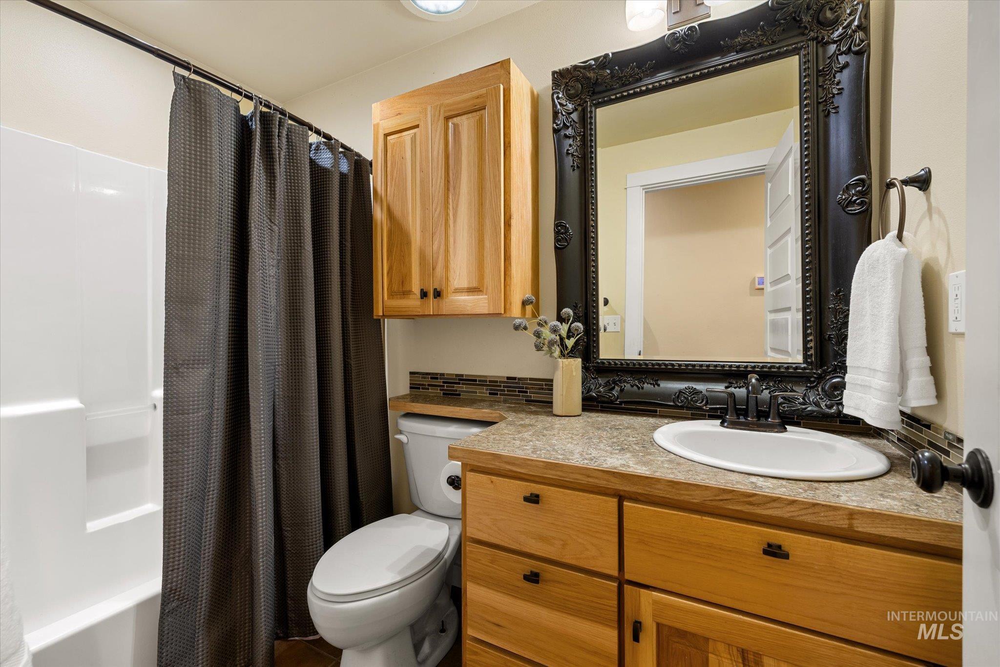 Full bathroom with vanity and shower / bath combo