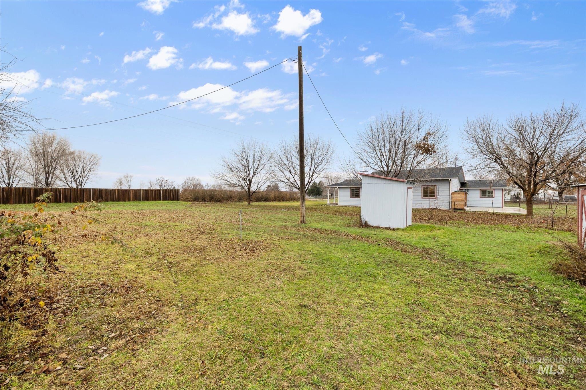 View of yard with an outbuilding