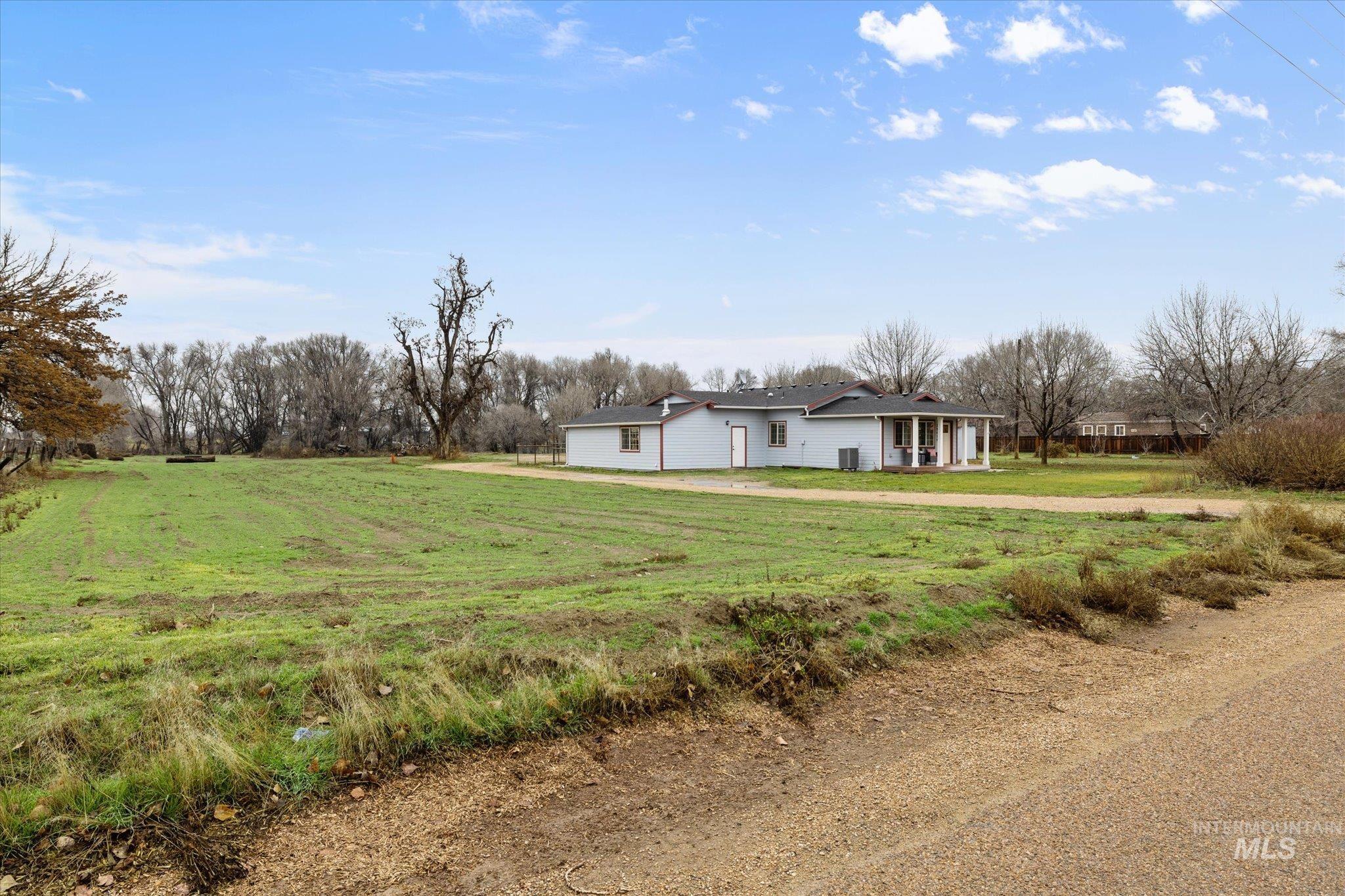 View of front of house featuring a front yard and covered porch