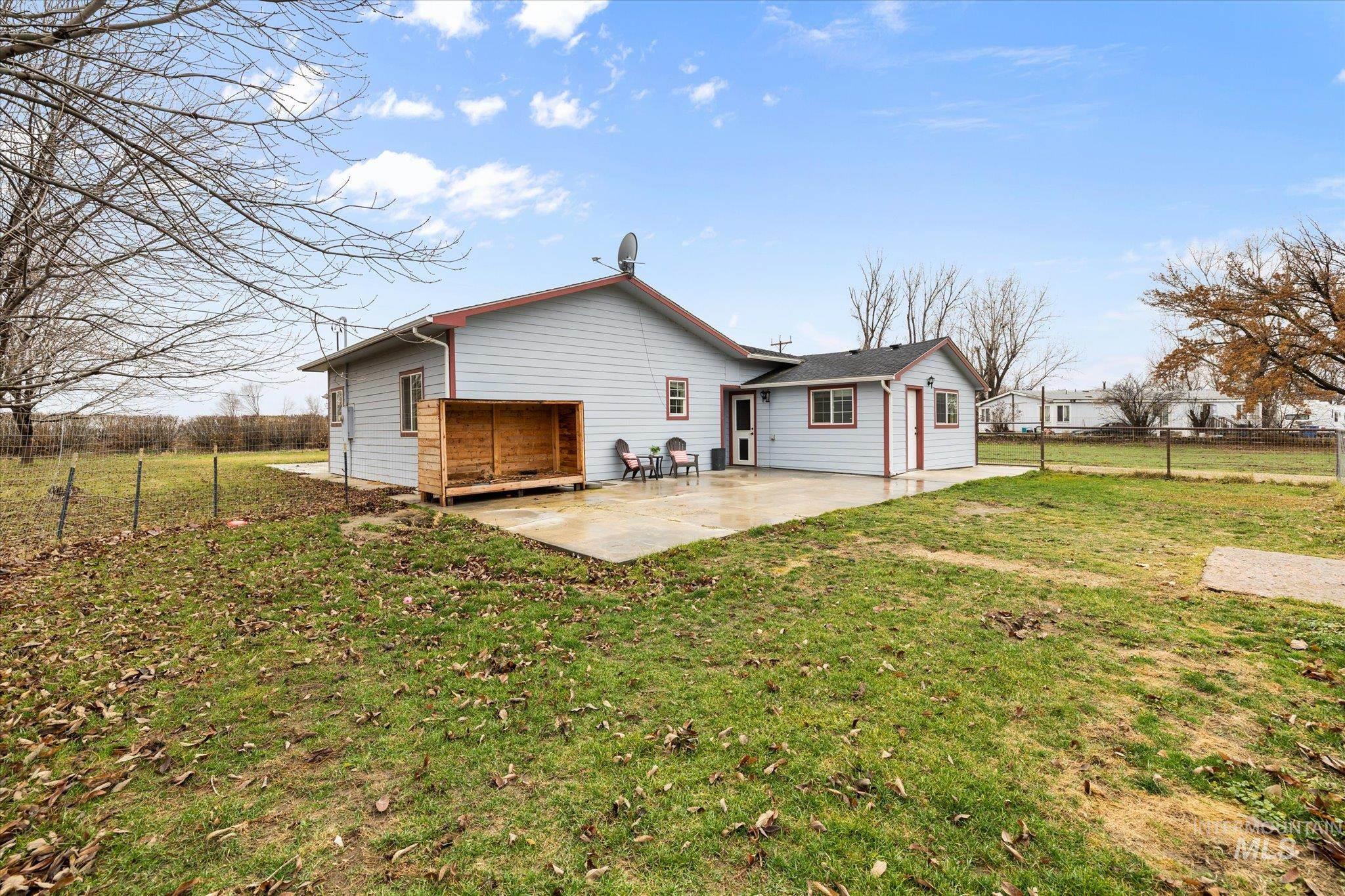 Rear view of property featuring a patio
