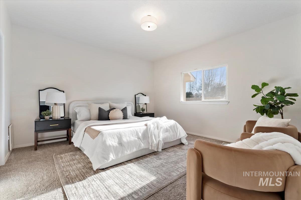 Carpeted bedroom with baseboards