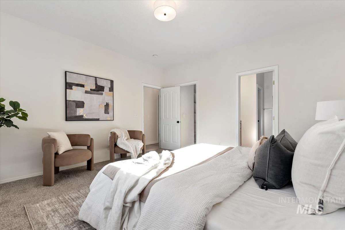 Bedroom with carpet floors and baseboards