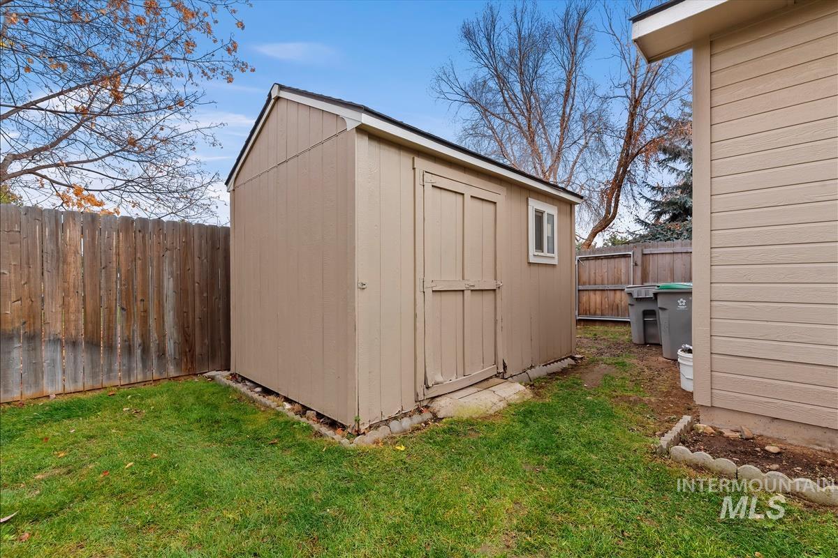 View of shed featuring a fenced backyard