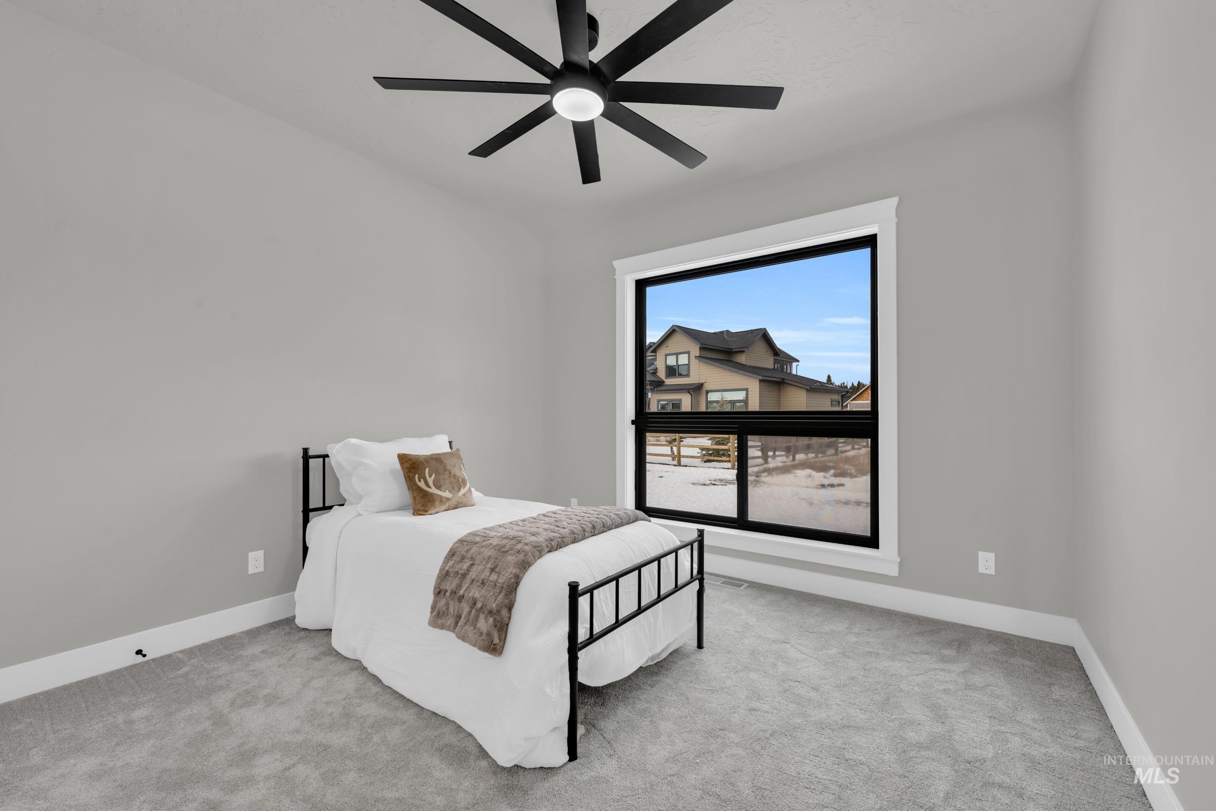 Bedroom with carpet flooring and ceiling fan