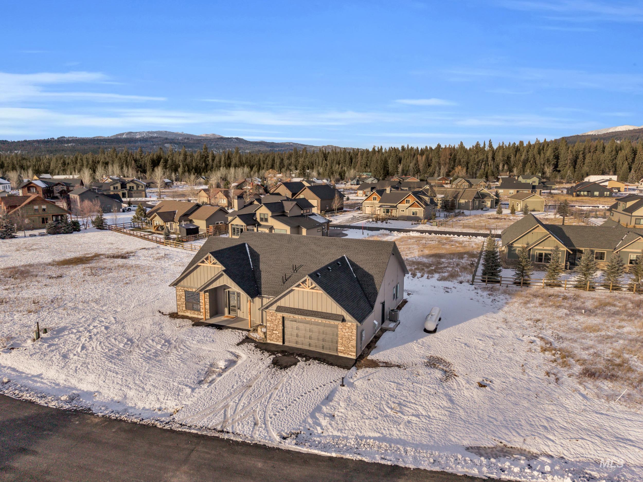 Snowy aerial view with a residential view