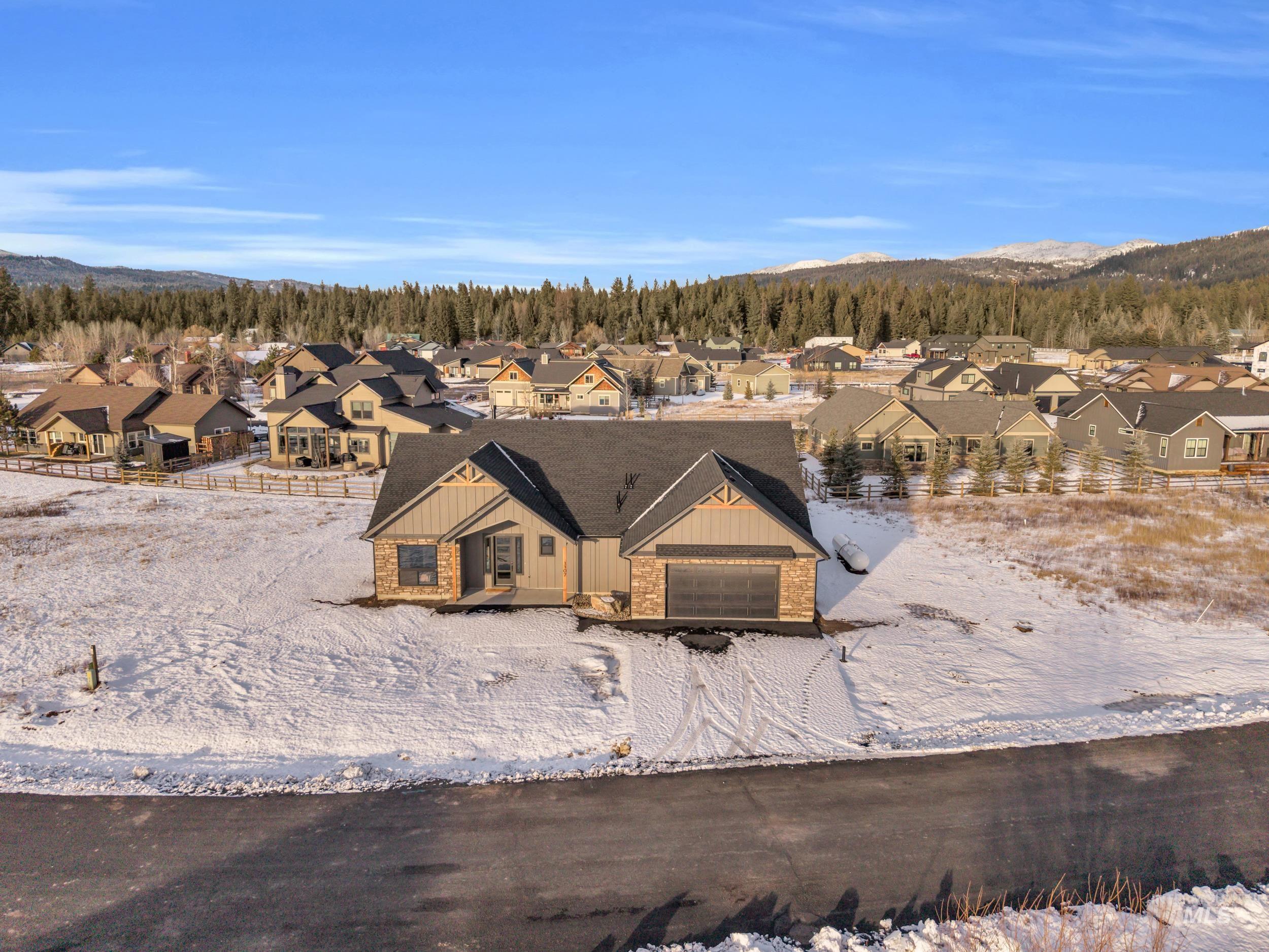 View of front of home featuring board and batten siding and a residential view