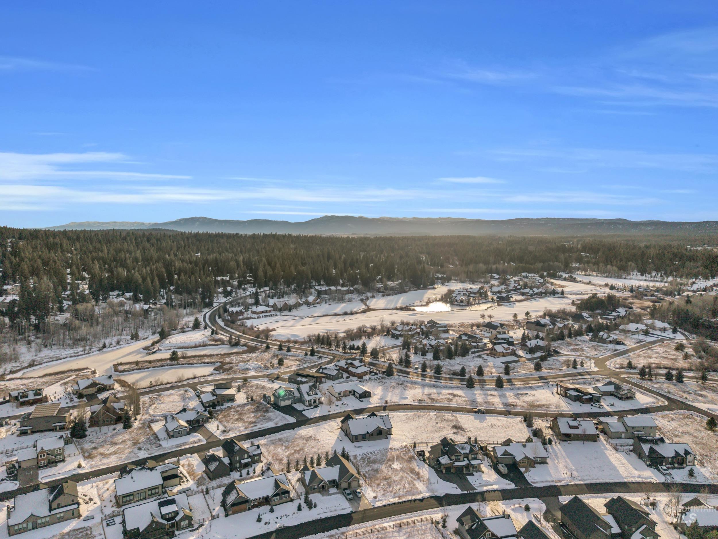 View of property location with mountains and nearby suburban area