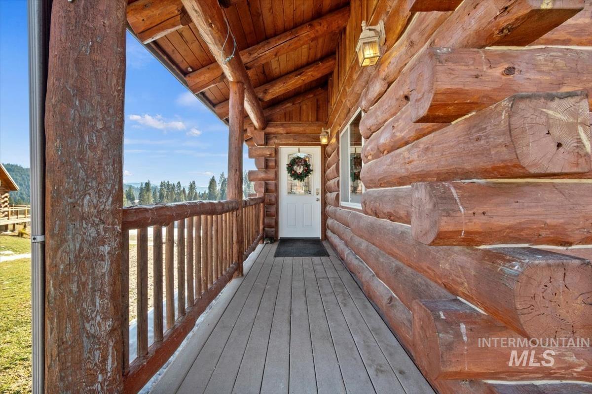 Property entrance with log exterior