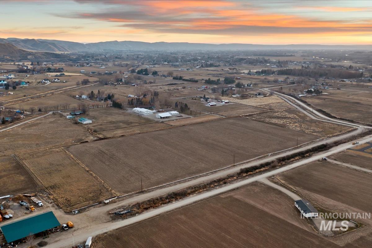 Aerial overview of property's location featuring a mountainous background