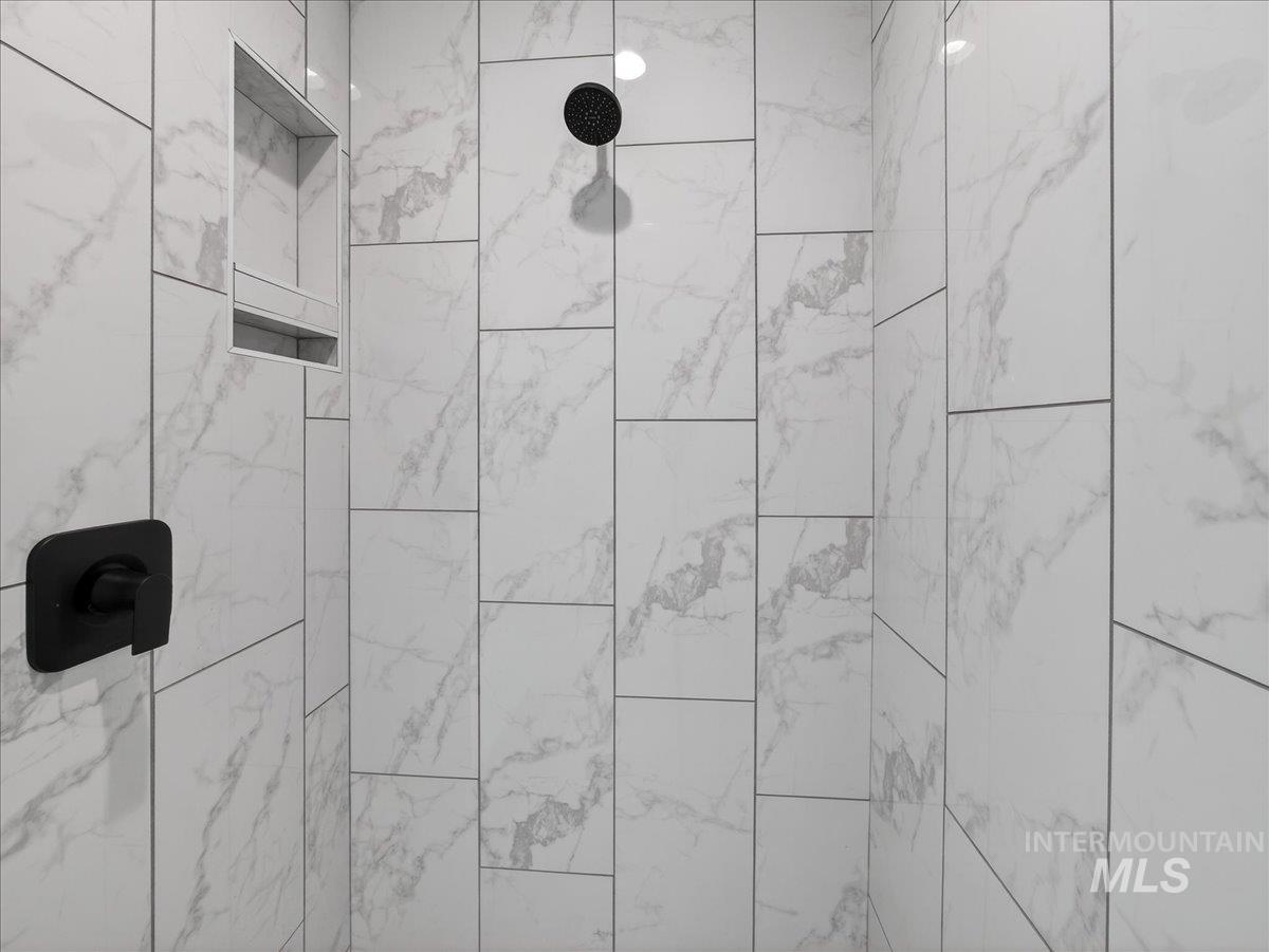 Bathroom view of a tile shower