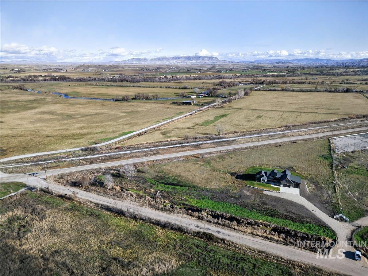 Overview of rural landscape featuring a mountain backdrop