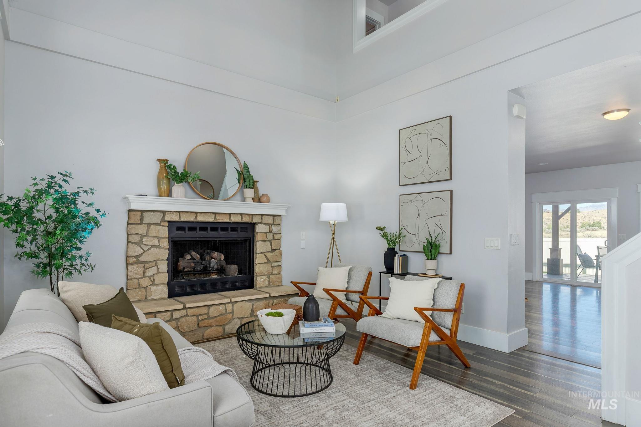 Living area with a fireplace and wood finished floors