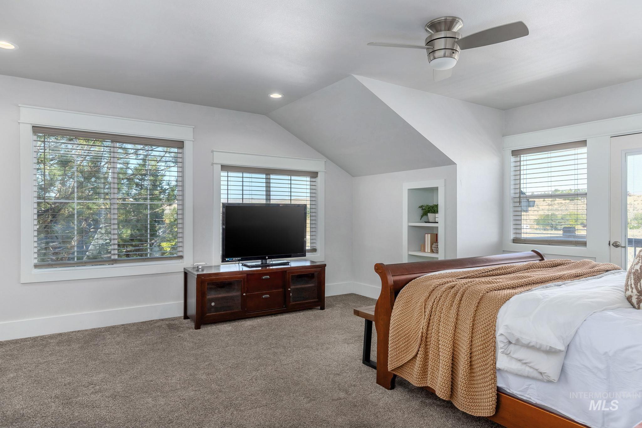 Bedroom featuring carpet flooring, lofted ceiling, ceiling fan, and recessed lighting