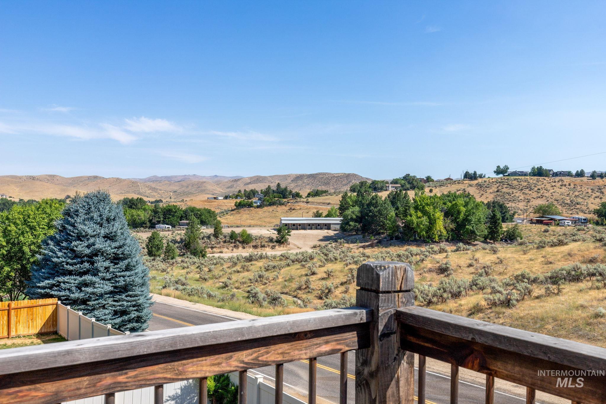 View of mountain backdrop featuring rural landscape