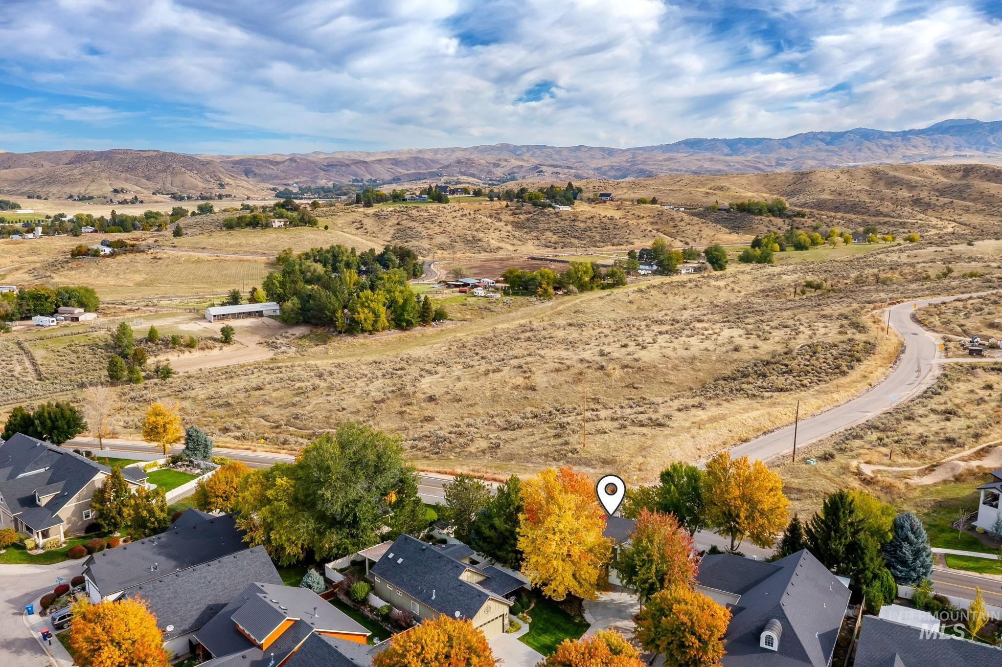 Aerial view of residential area with a mountainous background