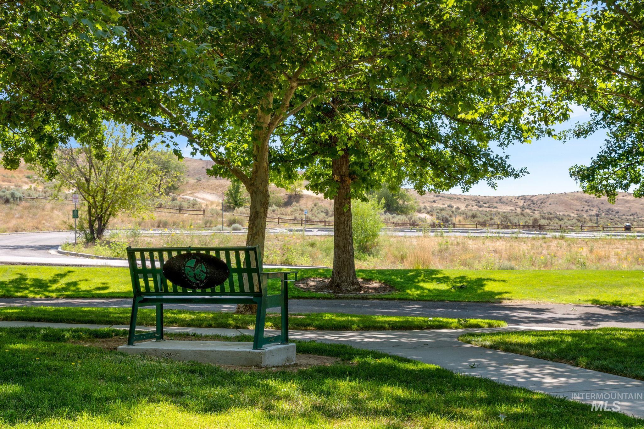 View of property's community featuring a lawn