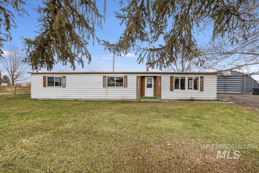 Ranch-style home with a front yard