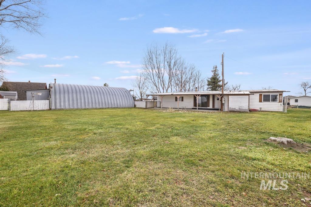 Back of property with a patio